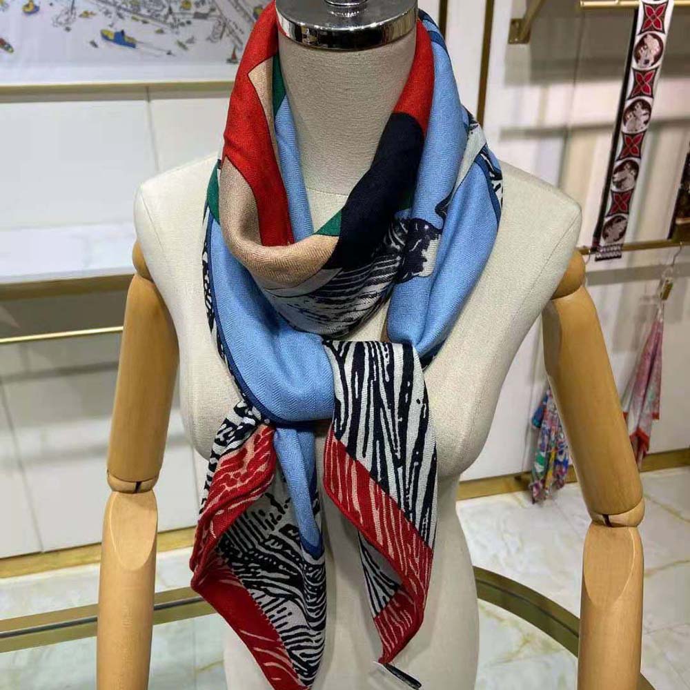 Model wearing Hermes Women Cavalier En Formes Scarf 90-Blue styled as headscarf