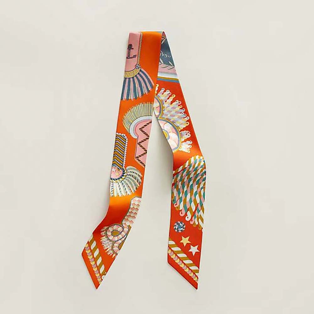 Close-up of Hermes Women Epaulettes De Gala Twilly-Orange silk texture