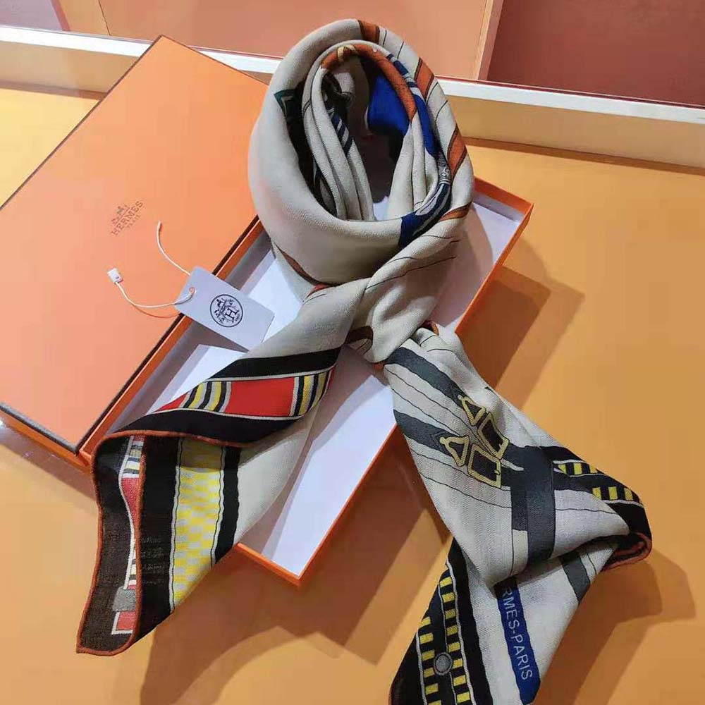 Close-up on luxurious silk texture of Hermes Women Lettres Equestre Scarf 90-White