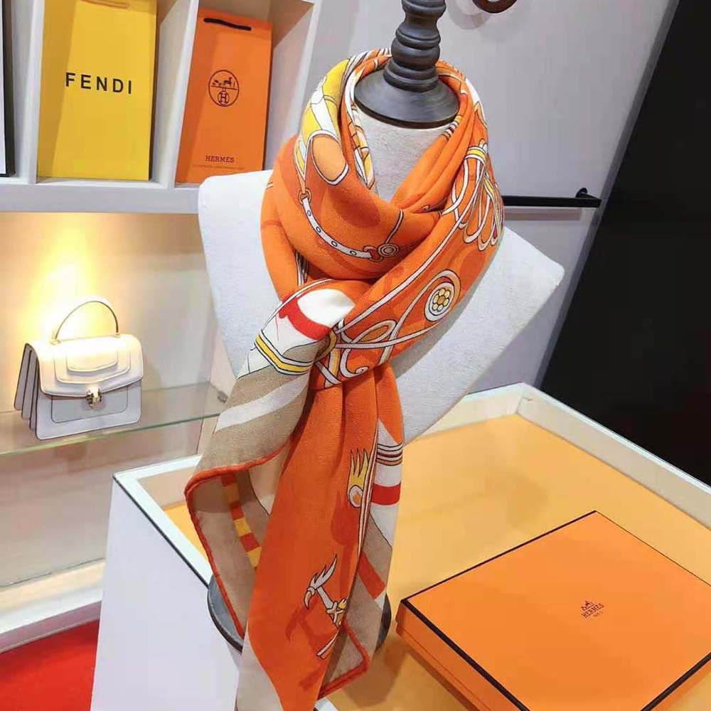 Styled shot showing Hermes Women Voitures En Equilibre Shawl draped over shoulder