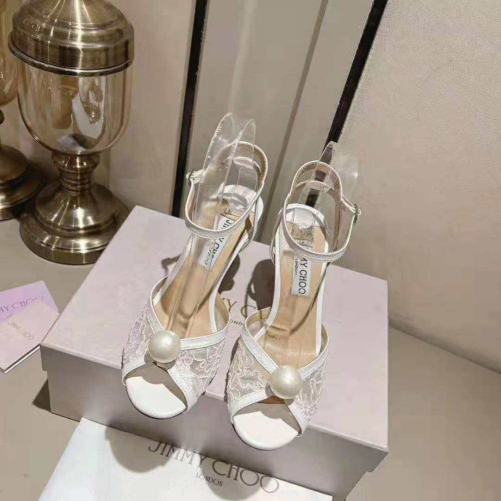 Close-up of pearl accents on Jimmy Choo Women Sacora 85 Ivory Floral Lace Sandals
