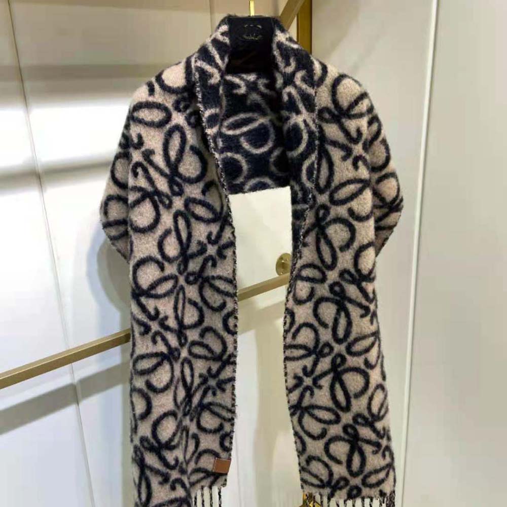 Close-up detail of Loewe Anagram embroidery on black scarf