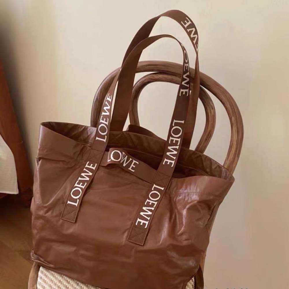 Side angle showing fold silhouette and hardware on Loewe Unisex Shopper