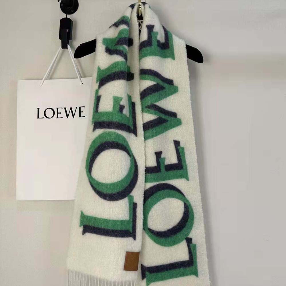 Side angle showing Loewe embossed logo detail on white scarf
