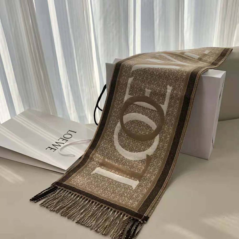 Close-up detail of Loewe embossed logo on white Love Scarf