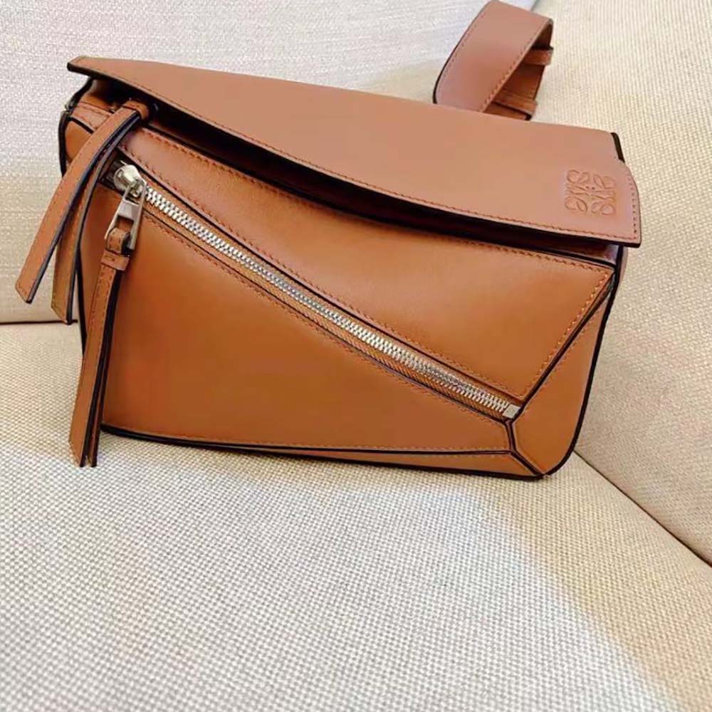 Close-up of silver-tone zipper and stitching on Loewe Small Puzzle Bumbag