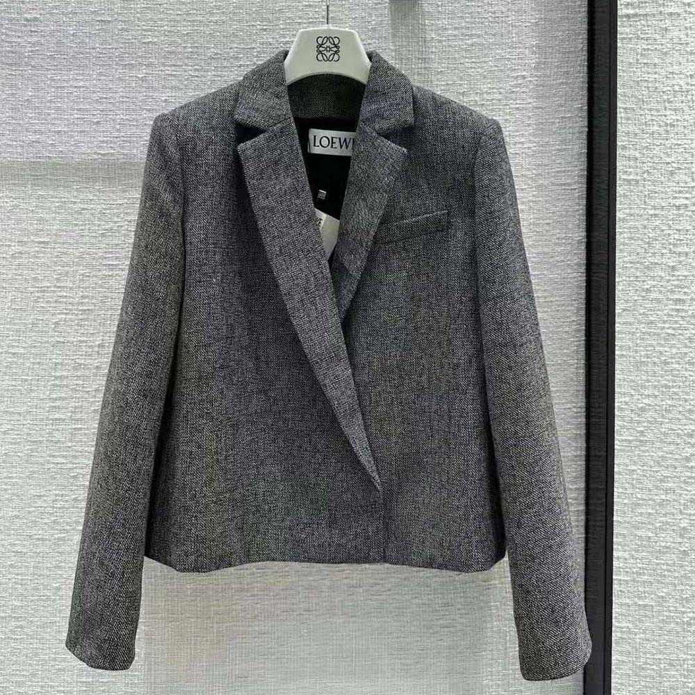Close-up of Loewe logo-engraved buttons on tailored wool jacket