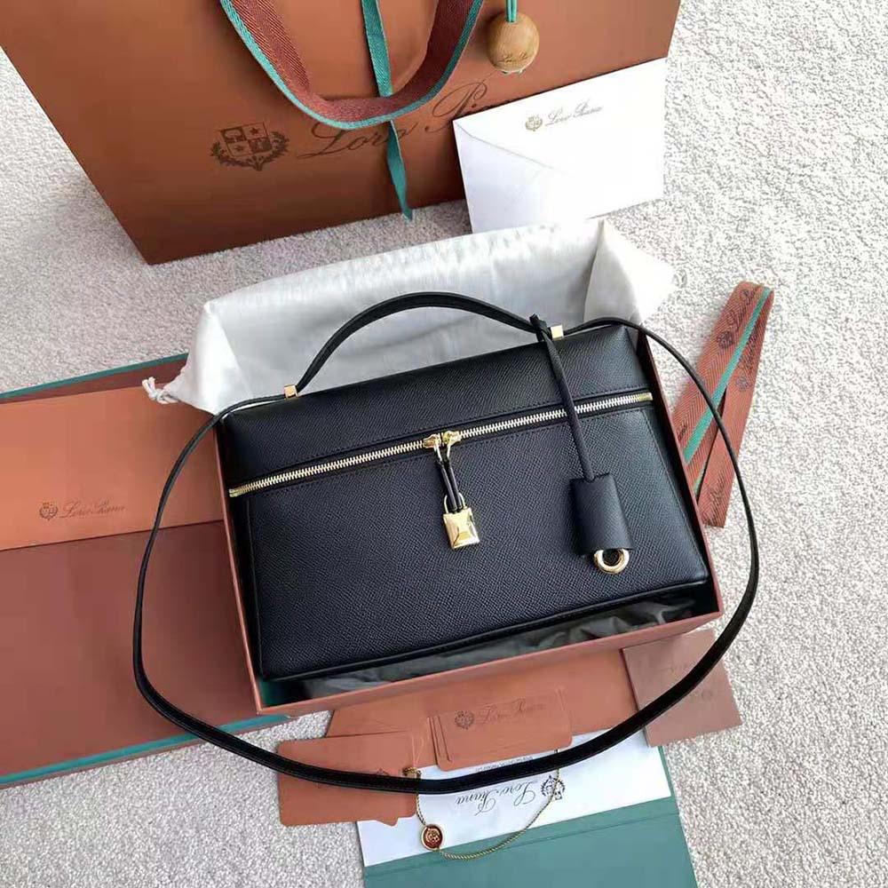 Side angle showing smooth calfskin texture on Loro Piana Women Extra Bag