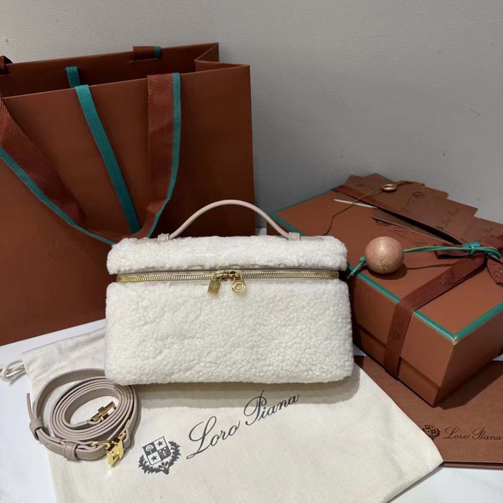 Close-up of magnetic closure and silver hardware on Loro Piana pouch