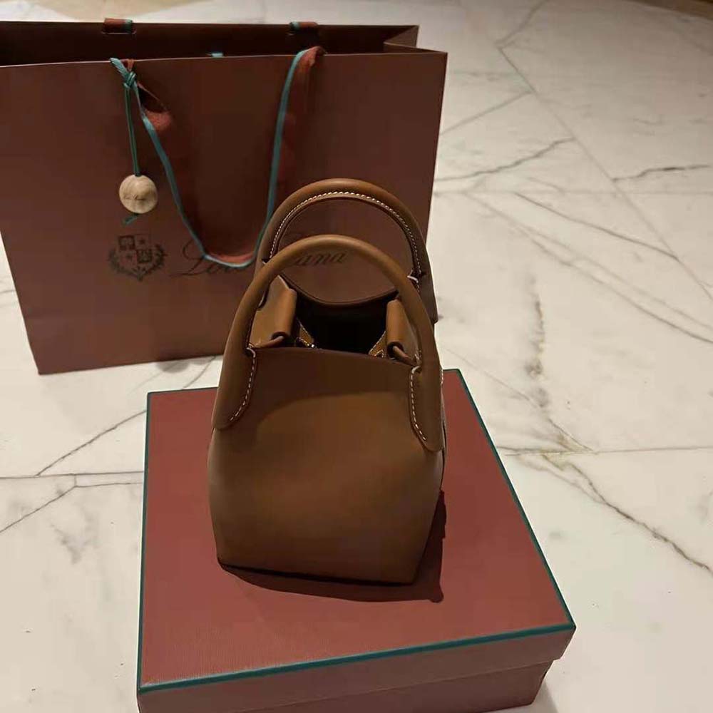 Side angle showing magnetic closure of Loro Piana Women Micro Bale Bag