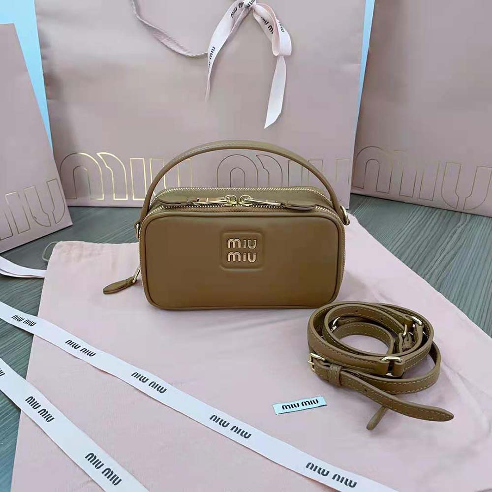 Close-up of silver metal lettering logo on Miu Miu Women Arcadie Leather Bag