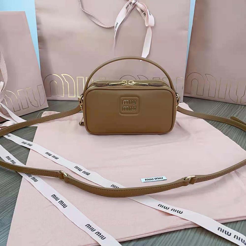 Side angle showing brown leather texture of Miu Miu Women Arcadie Leather Bag