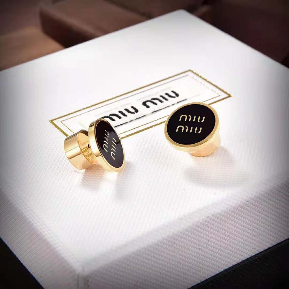 Close-up of glossy finish on Miu Miu Women Enameled Metal Earrings