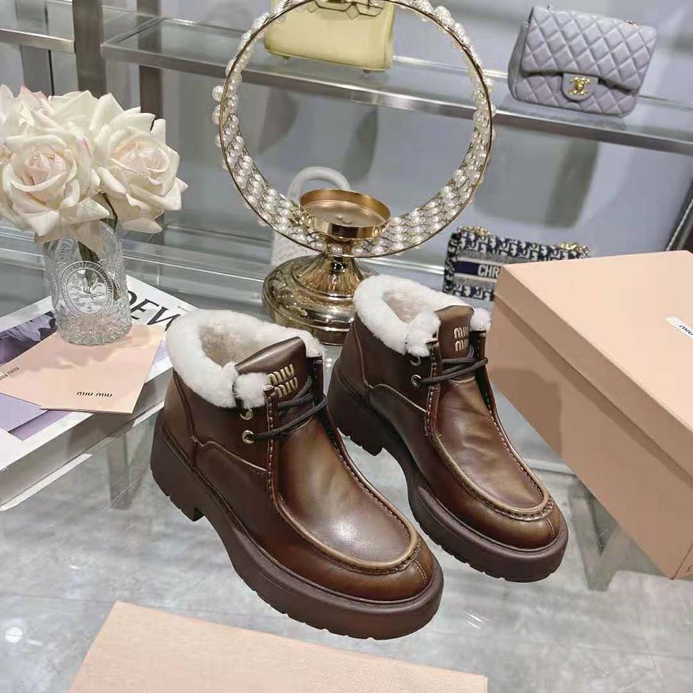 Front view of slim silhouette in Miu Miu Women Fumé Leather Booties-Brown