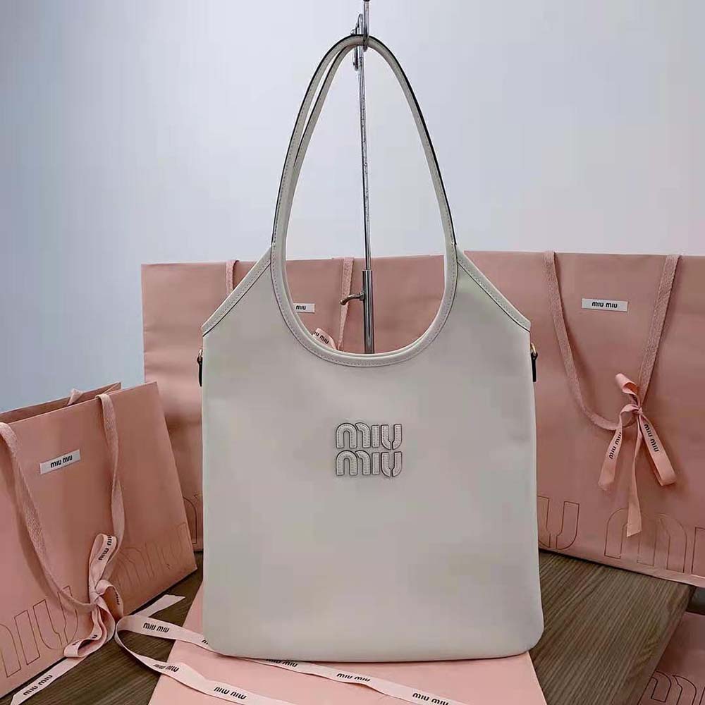 Close-up of white leather and signature logo on Miu Miu Women IVY Leather Bag