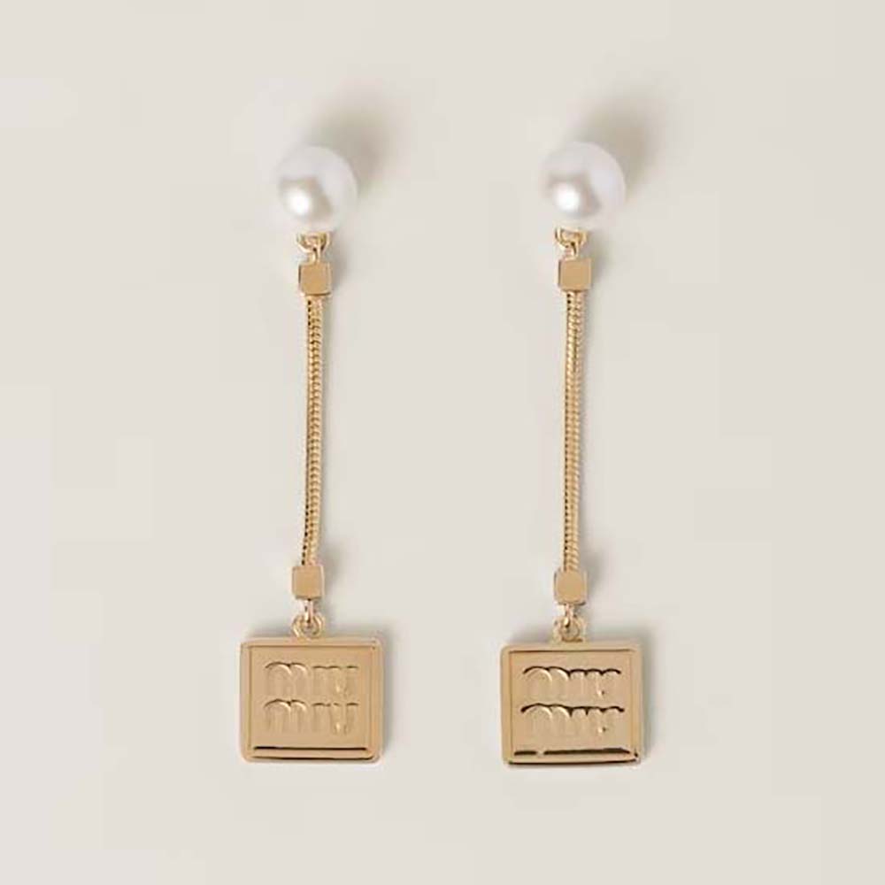 Close-up of Miu Miu Women Metal Earrings with Artificial Pearls gold finish