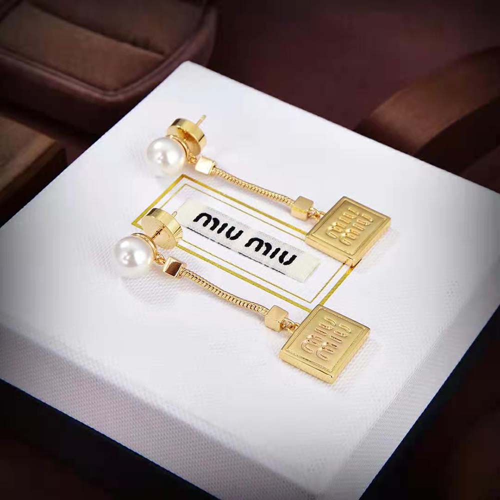 Side angle showing delicate silhouette of Miu Miu Women Metal Earrings