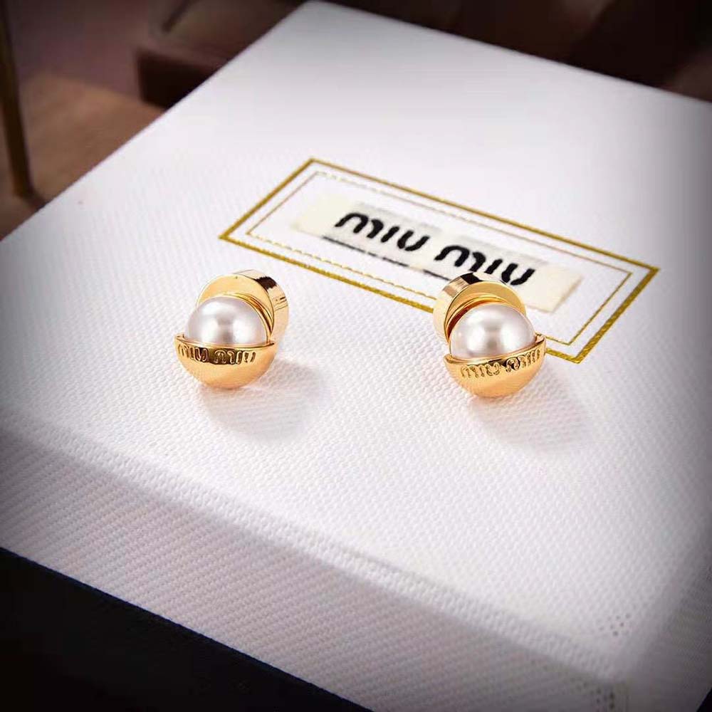 Close-up detail of pearl and metal design on Miu Miu Women Metal and Pearl Earrings