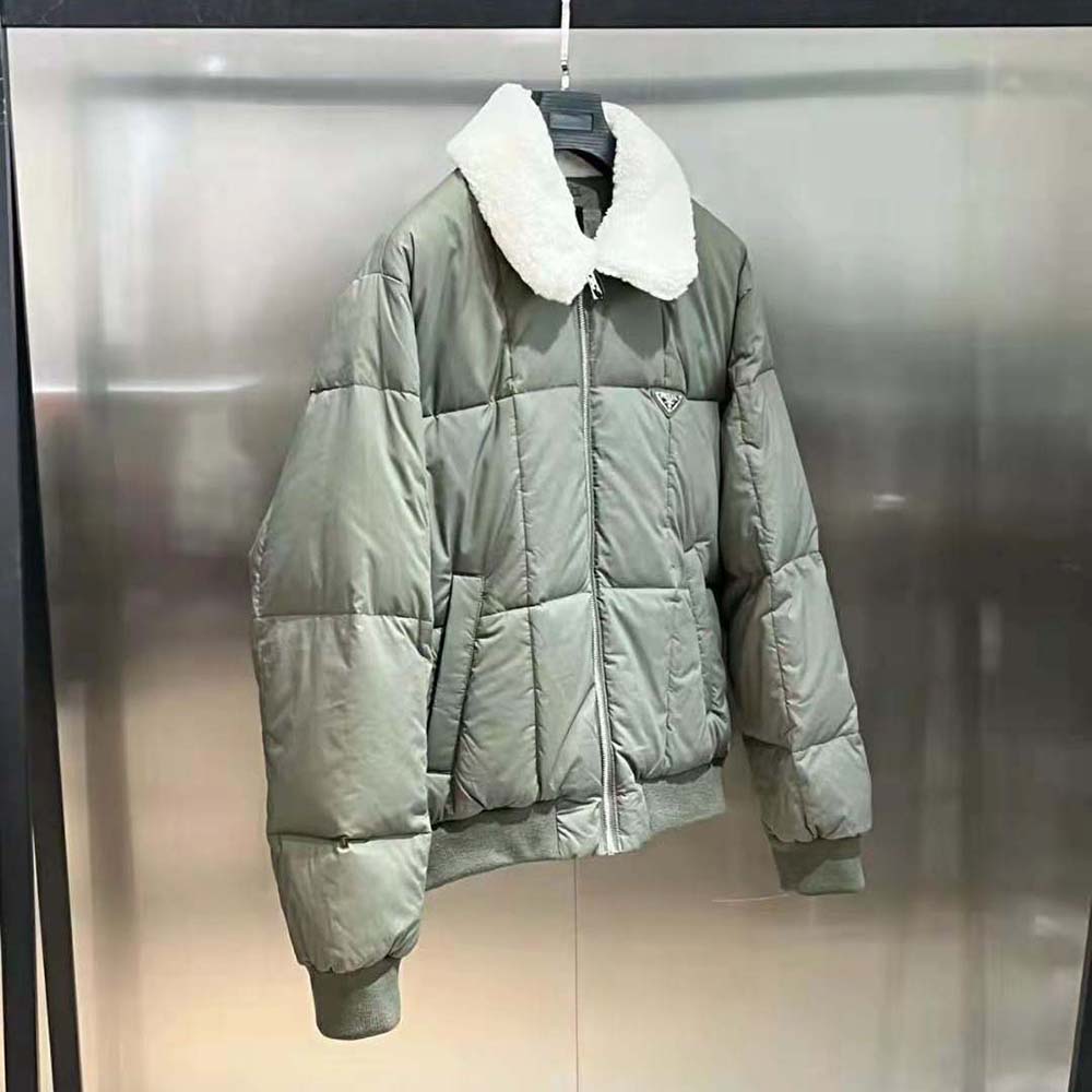 Side profile showing silhouette of Prada Men Cropped Technical Cotton Down Jacket