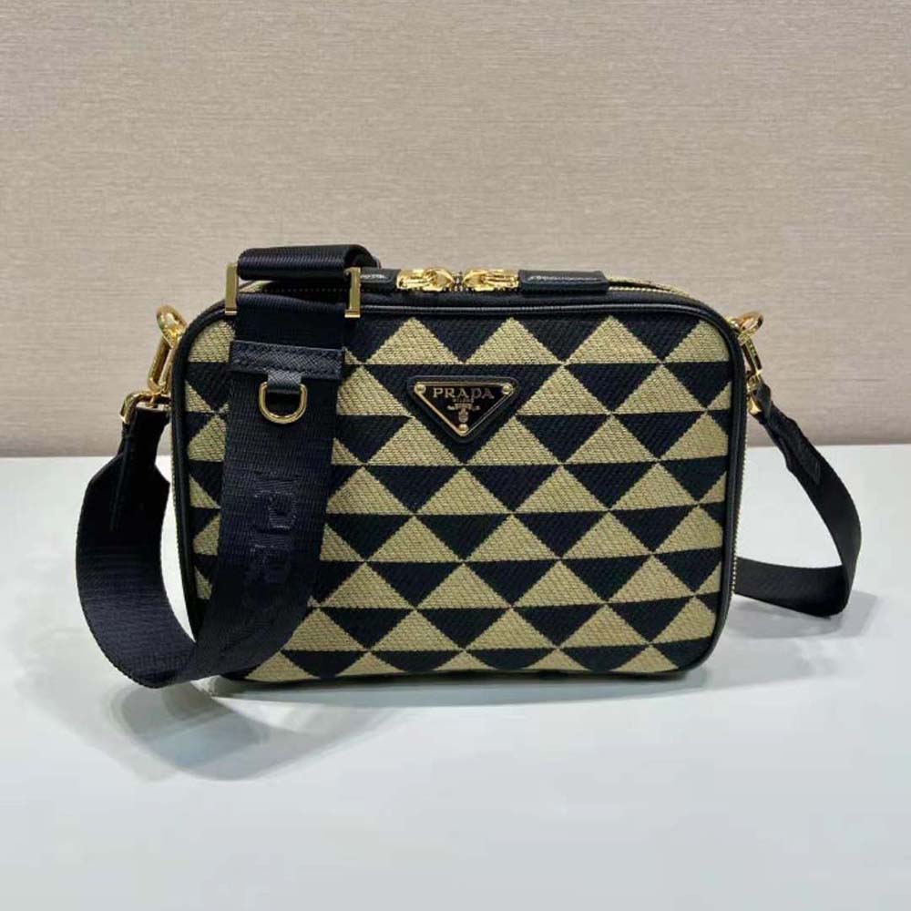 Close-up of embroidered detail on Prada Men Symbole Embroidered Fabric Bag-Beige/Black