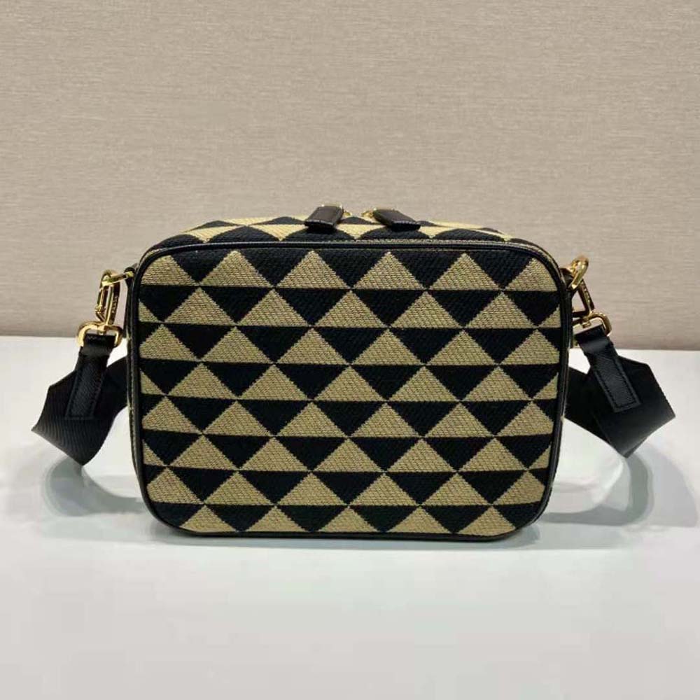 Side profile showing adjustable strap on Prada Men Symbole Embroidered Fabric Bag-Beige/Black