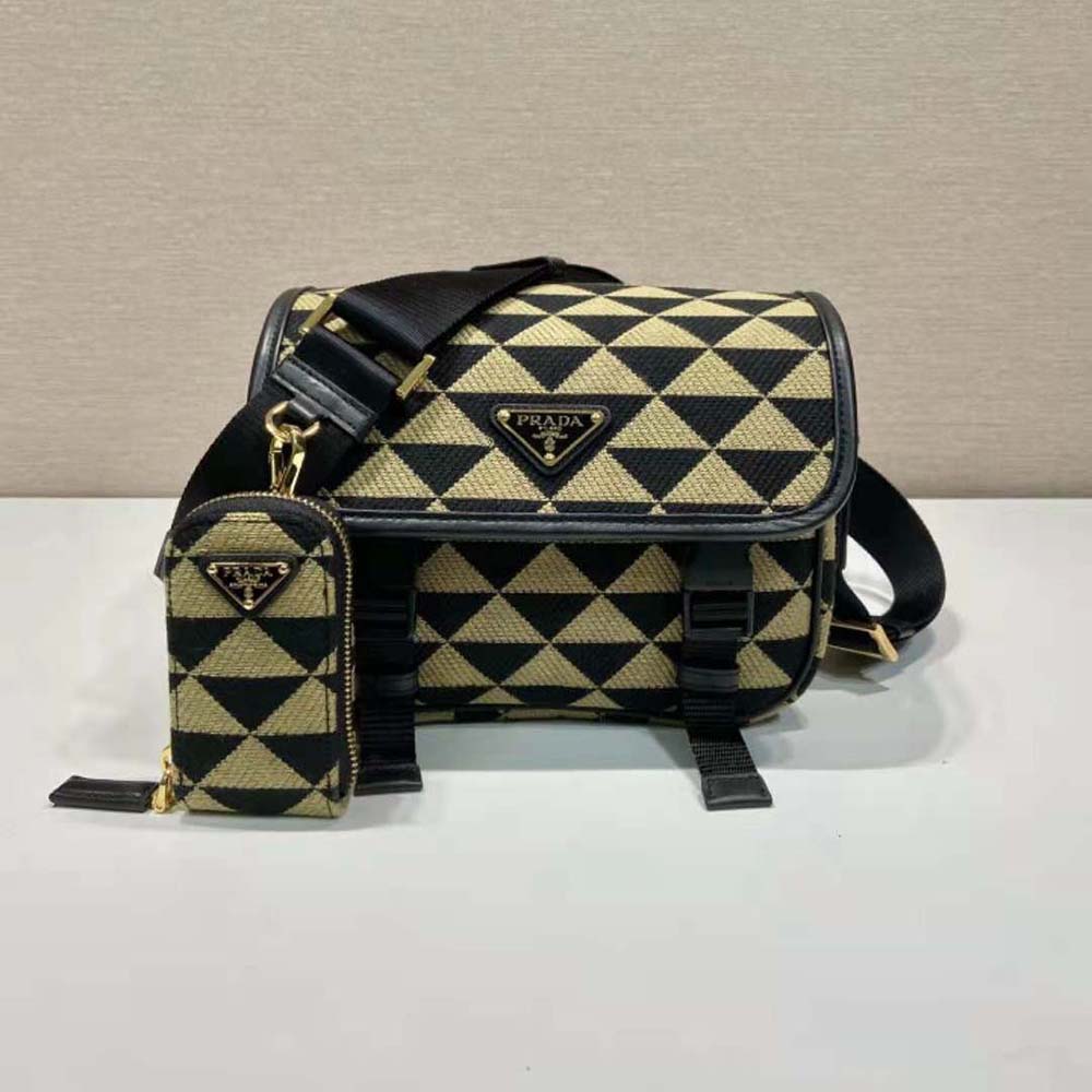 Close-up of beige embroidery on Prada Men Symbole Embroidered Fabric Bag