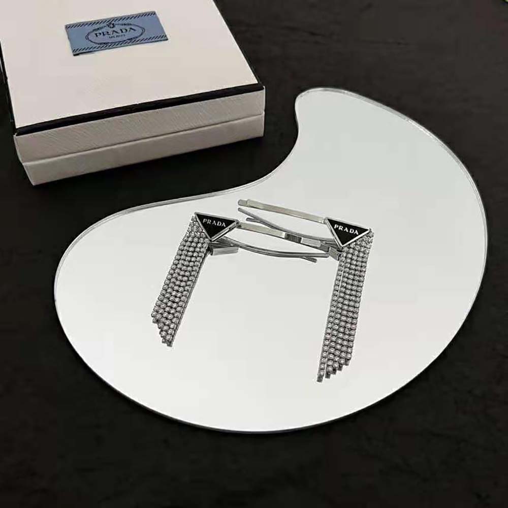 Side angle of Prada Women Brass Hair Clip showing clasp mechanism