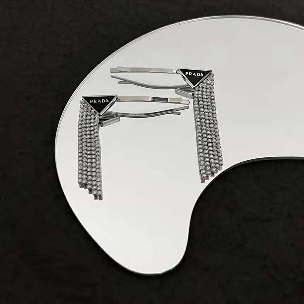 Styled hair with Prada Women Brass Hair Clip securing a low bun