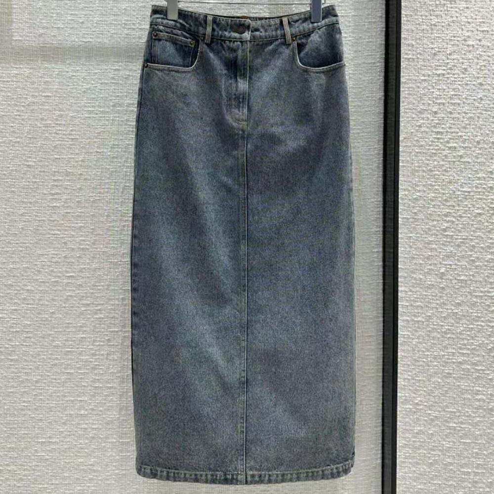 Close-up of Prada triangle logo detail on denim maxi skirt