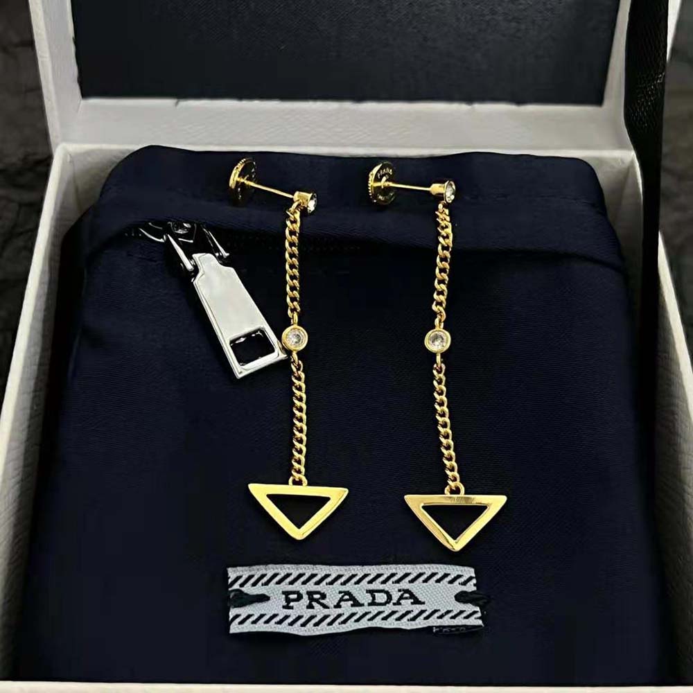 Close-up detail of diamond accents on Prada Women Eternal Gold Cut-out Drop Earrings