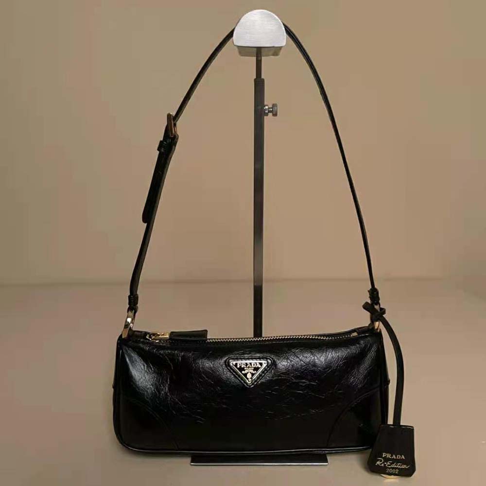 Side angle showing adjustable strap on Prada Women Re-Edition 2002 bag