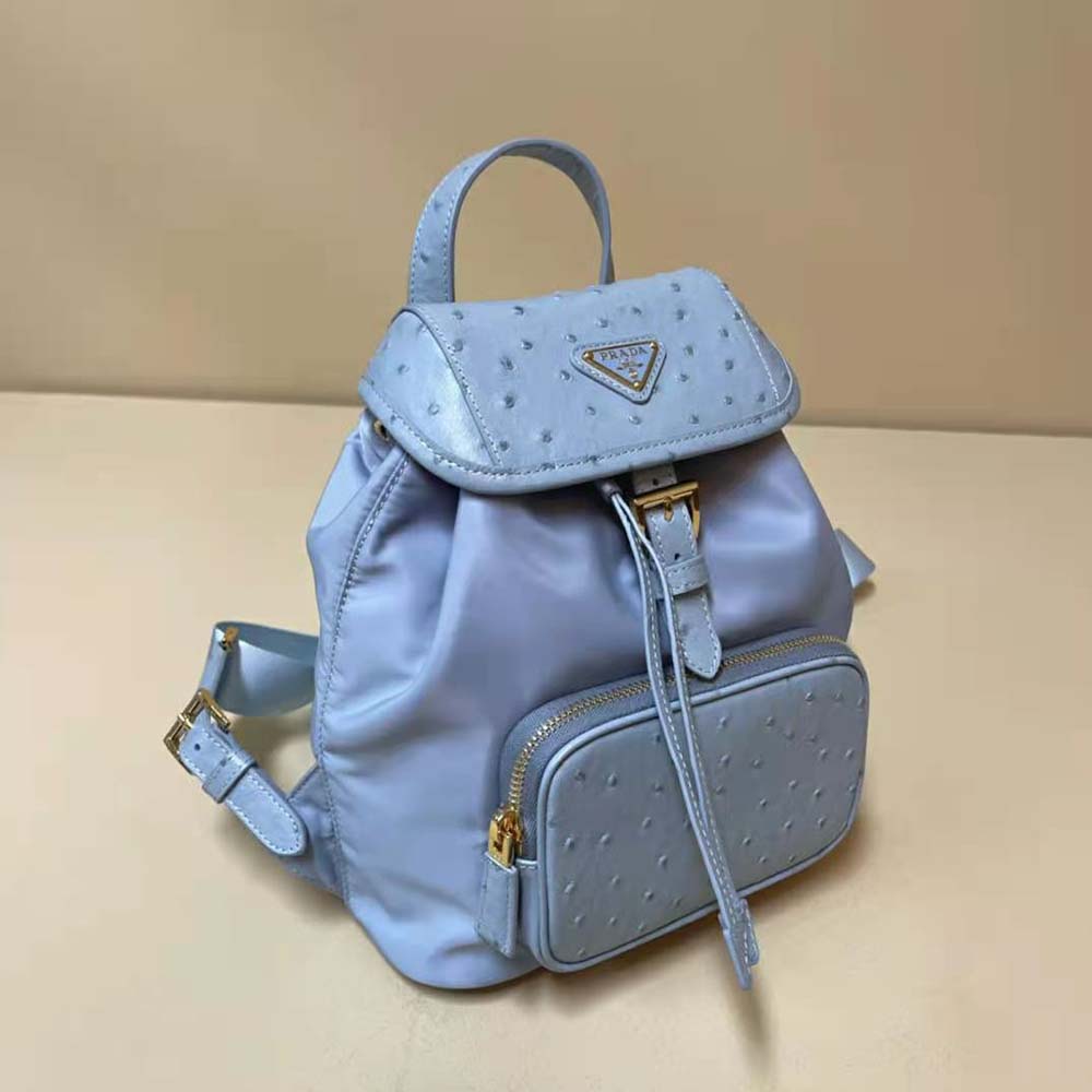 Side angle showing silver-tone hardware on Prada Women Re-Nylon and Ostrich Leather Backpack-Blue