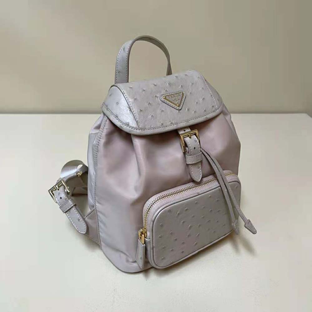 Side angle showing silver hardware on Prada Re-Nylon pink backpack