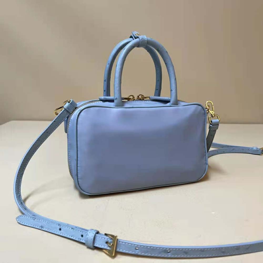 Side angle showing silver hardware on Prada Women Re-Nylon and Ostrich Leather Two-handle Bag-Blue