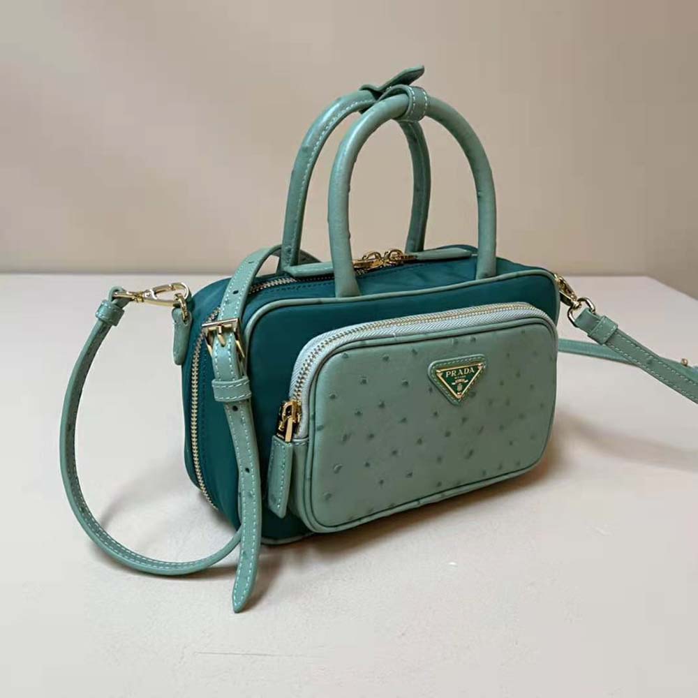 Side view showing two handles and silver hardware of Prada Women Re-Nylon and Ostrich Leather Two-handle Bag-Green