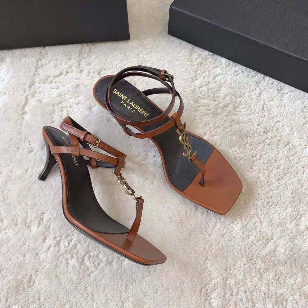 Back angle showing high heel and buckle closure on Saint Laurent Cassandra Sandals