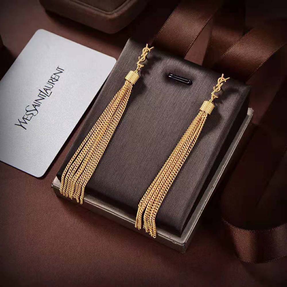 Close-up on Saint Laurent YSL Women Loulou Earrings light gold-colored brass finish