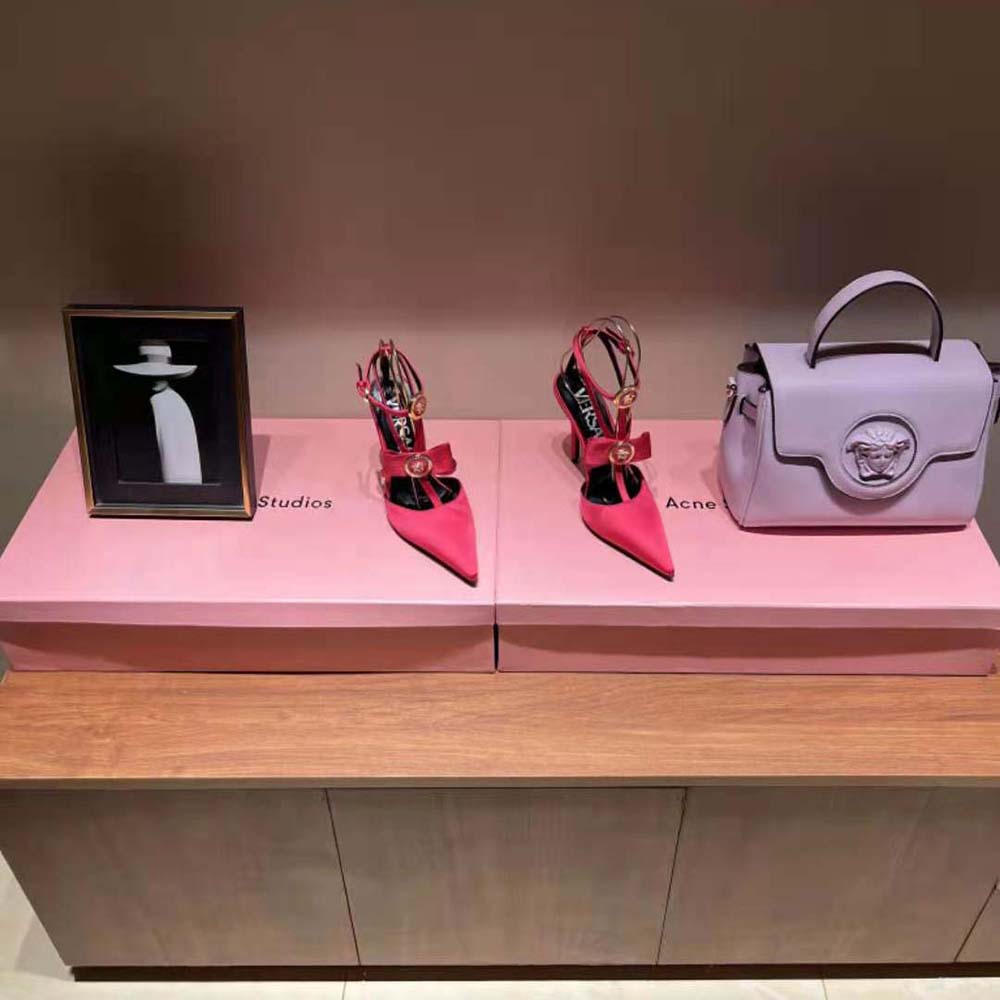 Rear view of Versace Women Gianni Ribbon Cage Satin Pumps-Rose highlighting heel height
