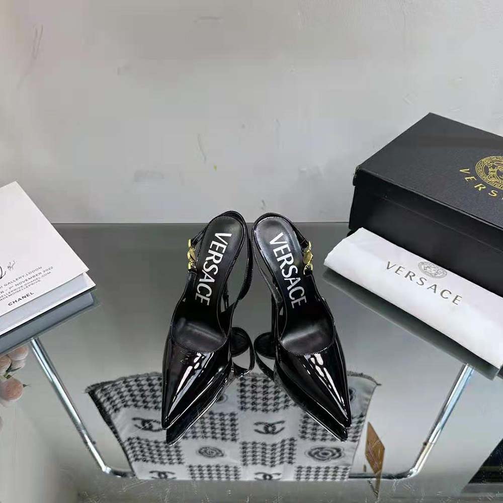 Close-up of gold Medusa emblem on Versace Women Medusa ’95 Slingback Pumps-Black