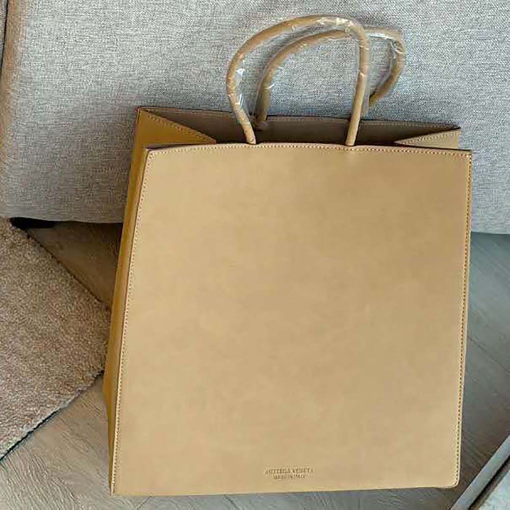 Close-up of intrecciato woven leather detail on the Bottega Veneta Small Brown Bag