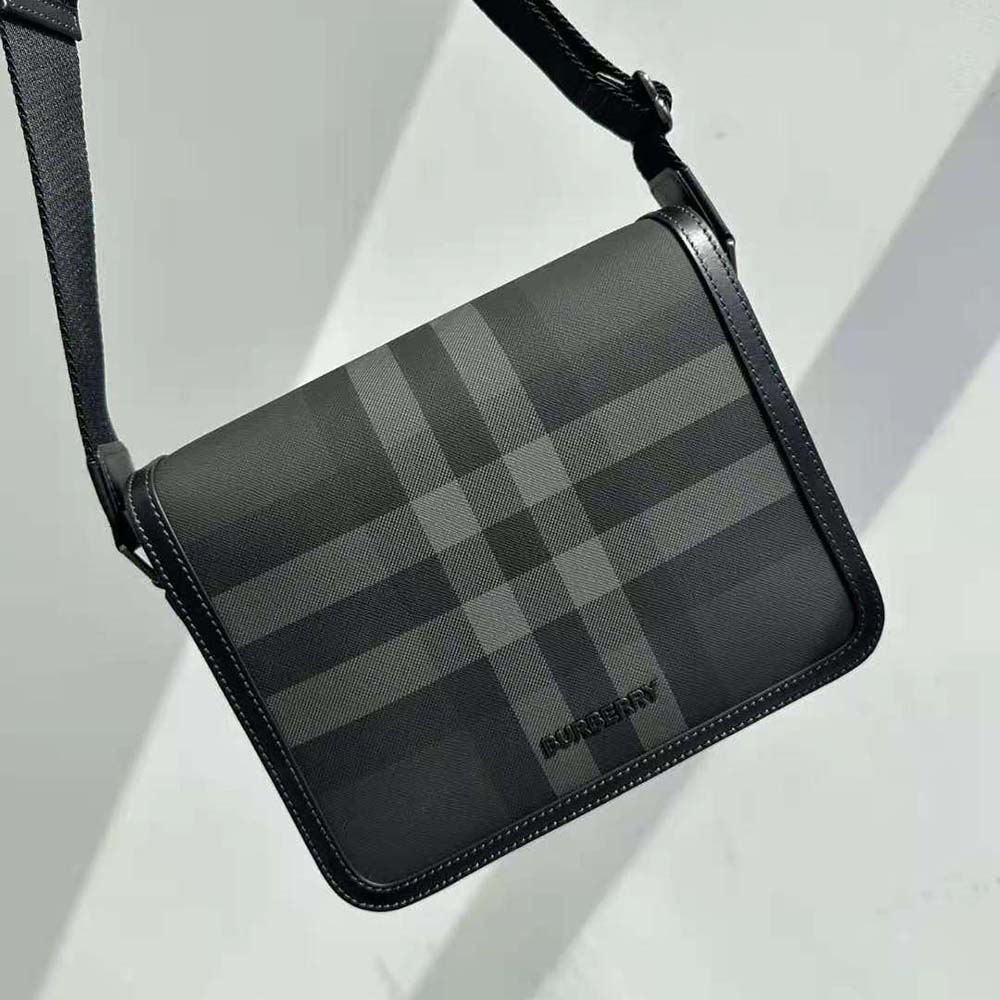 Close-up of black leather and signature check canvas detail on Burberry bag