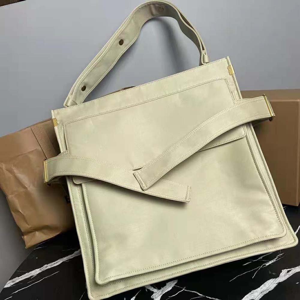 Close-up of green gabardine fabric and leather trim on Burberry tote
