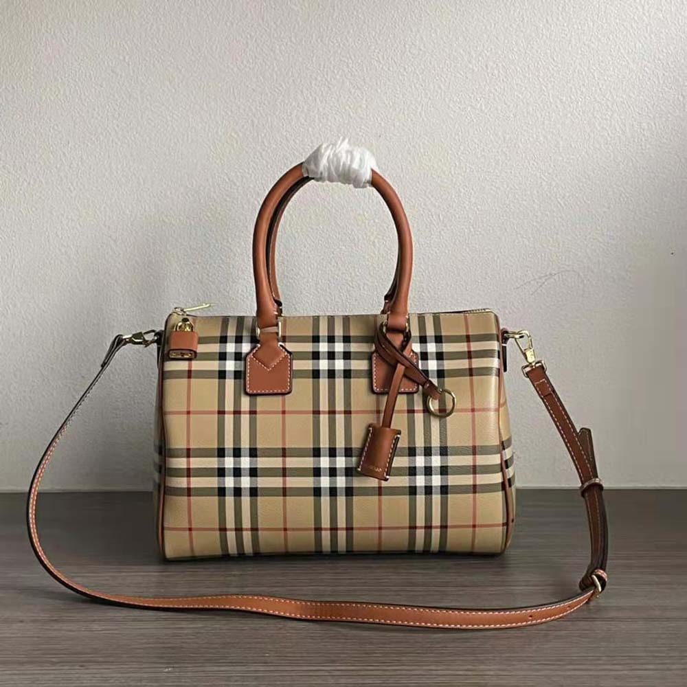 Close-up detail of Burberry logo and gold hardware on bowling bag