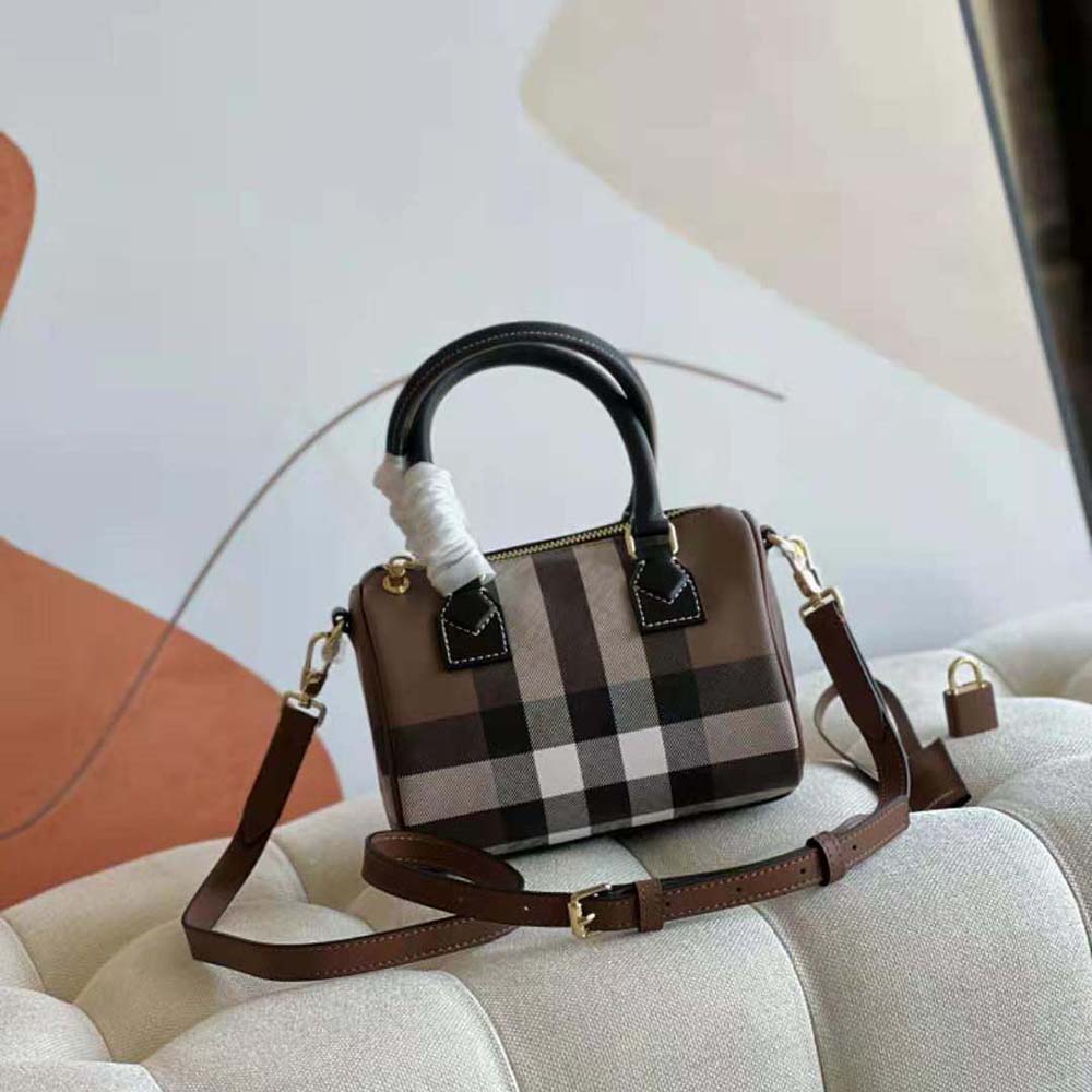 Close-up of Burberry Women Mini Check Bowling Bag-Black gold hardware and leather trim