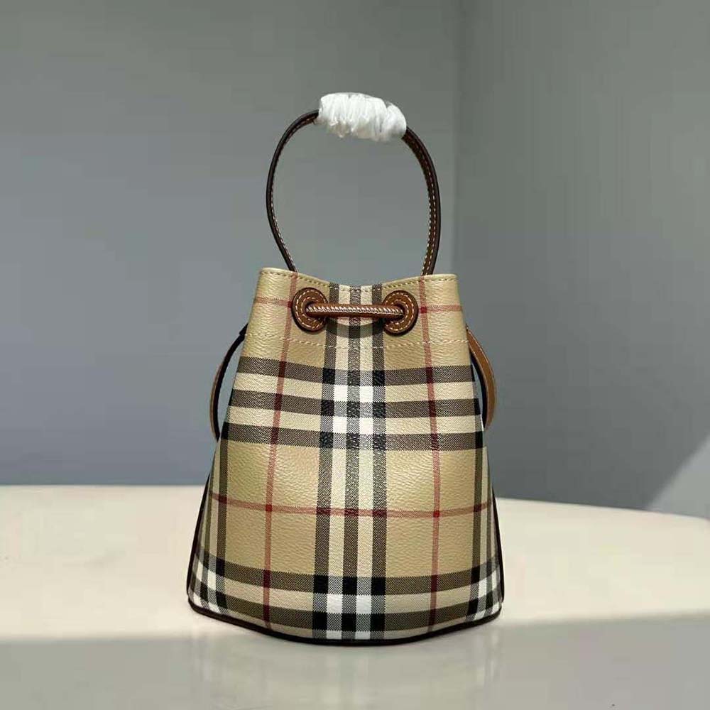 Side angle of Burberry Women Mini TB Bucket Bag-Brown showing leather texture