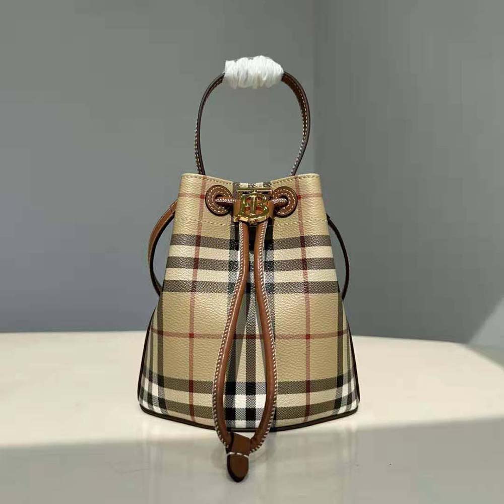 Close-up of gold TB clasp detail on Burberry Women Mini TB Bucket Bag-Brown