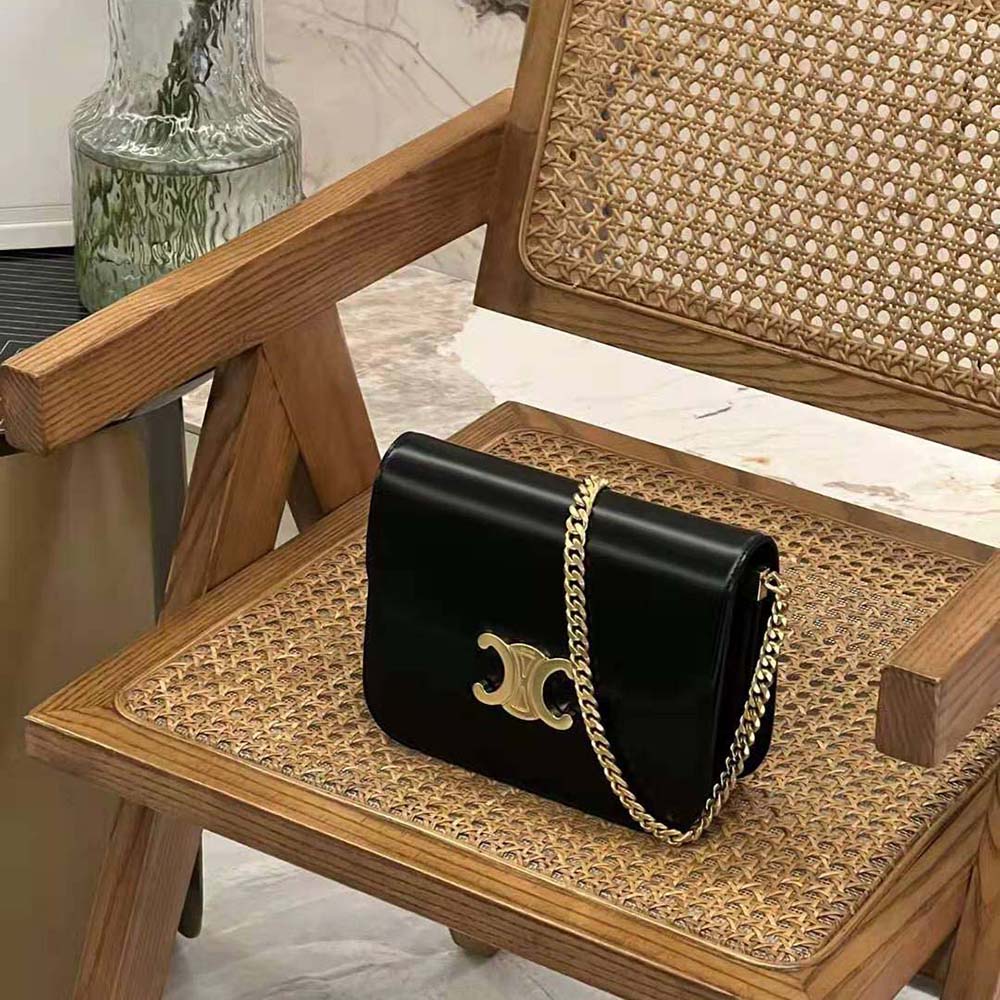 Close-up of gold Triomphe clasp on Celine Women Classique Triomphe Bag