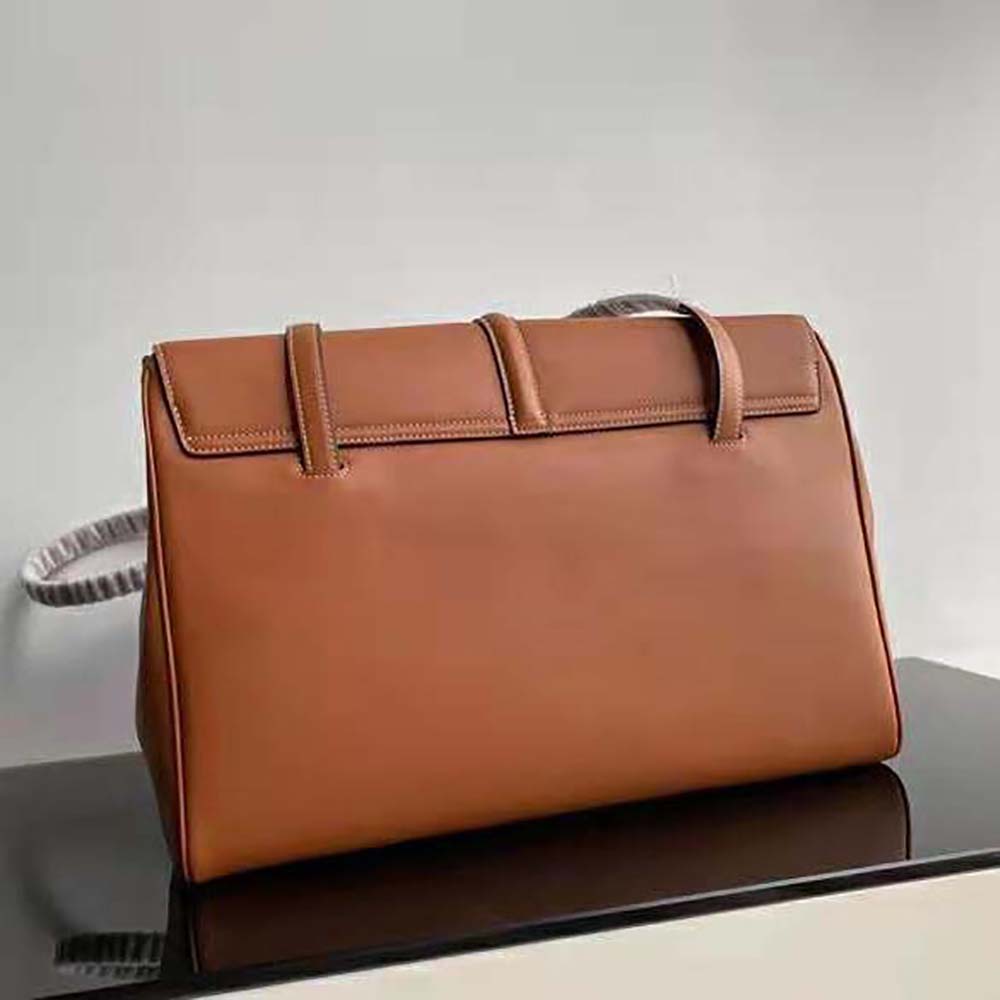 Side angle showing soft silhouette and magnetic flap closure of Celine Women Large Soft 16 Bag