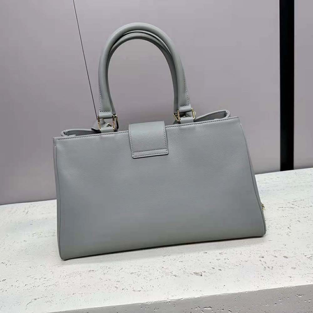 Side angle showing medium size and flap closure of Celine Appoline Bag