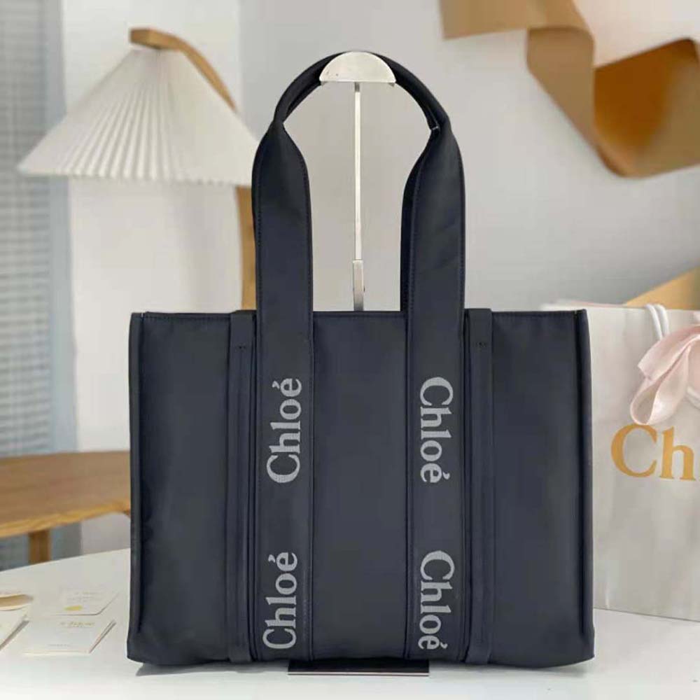 Close-up of gold-tone hardware on Chloe Women Large Woody Tote Bag-Black